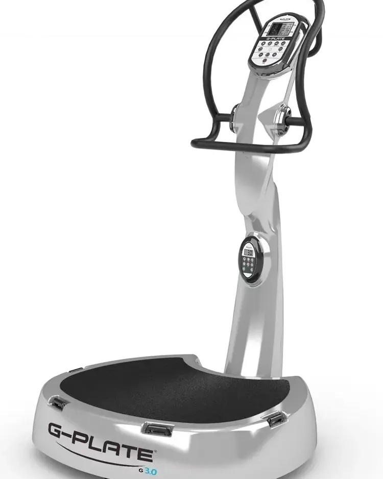 Commercial vibration plate bolted to floor in a busy gym