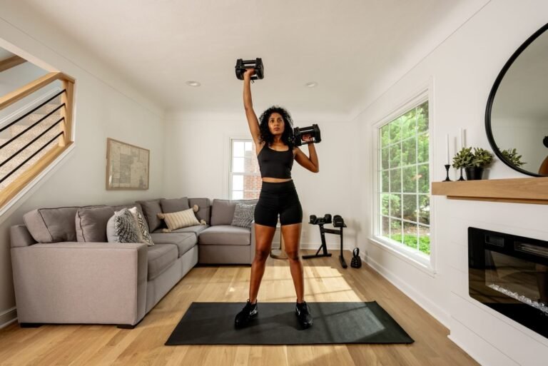Small apartment home workout gear arranged neatly on a wooden floor