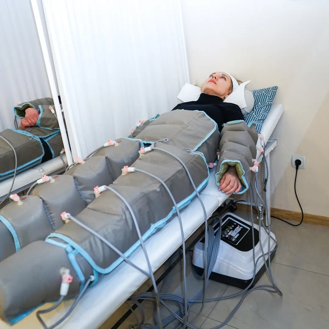 Three types of lymphatic drainage machines lined up on a table