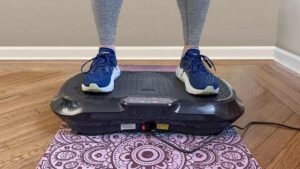Two vibration plates of different sizes side by side on a wooden floor