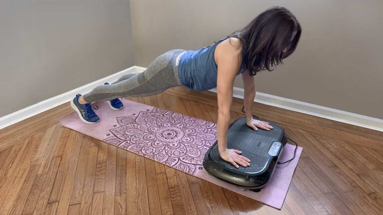 Vibration plate fitness machine in a bright living room with yoga mat