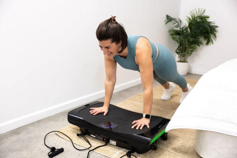 Vibration plate machine with handles in a bright home gym