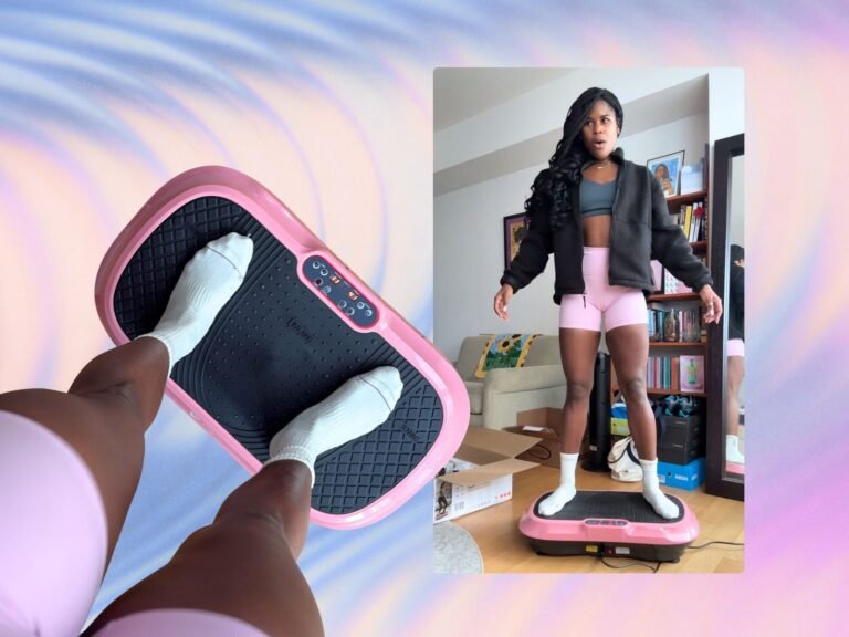 Vibration plate machine on wooden floor beside a rolled yoga mat