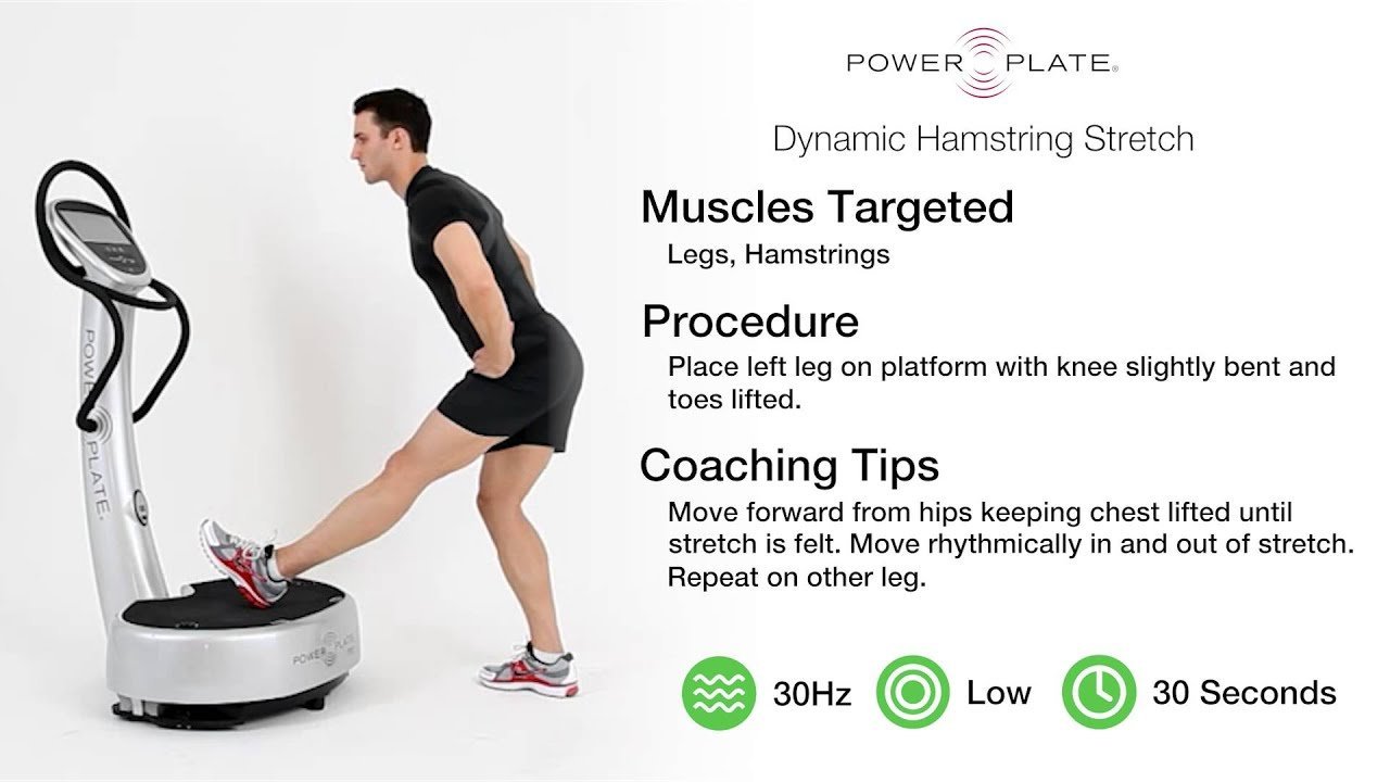 Woman stretching on a vibration plate in a bright modern living room